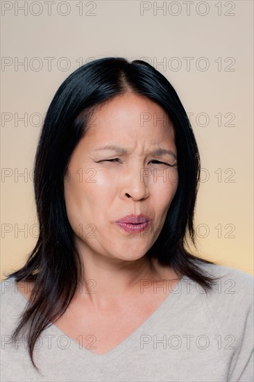 Portrait of woman with disgusted expression. Photo : Rob Lewine