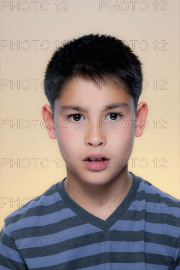 Portrait of boy with concerned expression. Photo : Rob Lewine