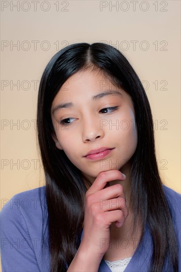 Portrait of girl with sad face. Photo : Rob Lewine