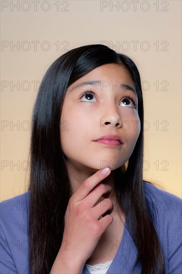 Portrait of girl lost in thoughts . Photo : Rob Lewine