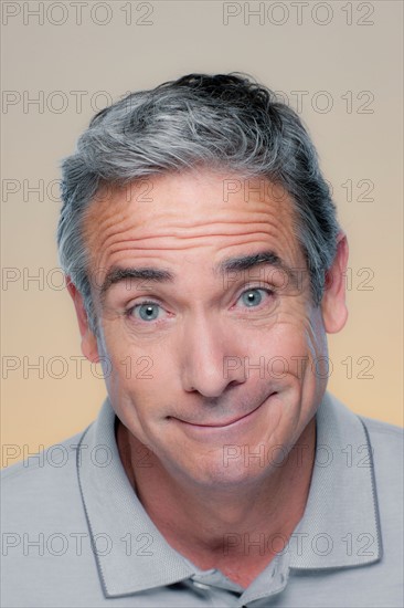 Studio Portrait of mature man smiling. Photo : Rob Lewine
