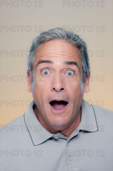 Studio Portrait of mature man looking surprised. Photo : Rob Lewine