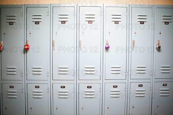 Row of lockers with different padlocks. Photo : Jessica Peterson