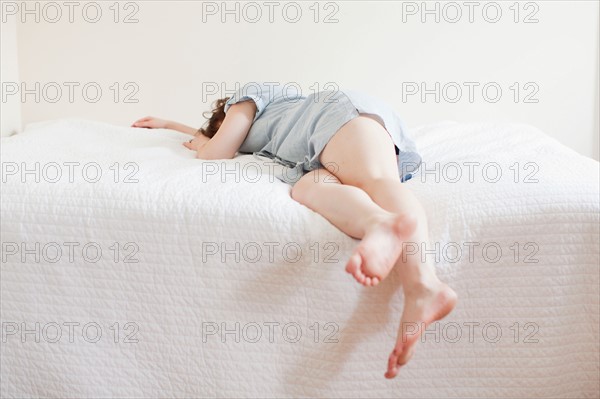 Attractive young woman sleeping in bed. Photo : Jessica Peterson
