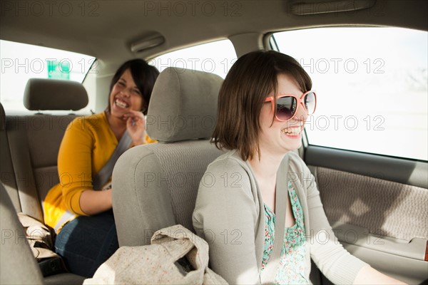 Two young women travelling by car. Photo : Jessica Peterson