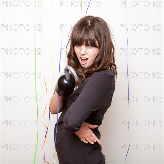 Studio Shot of young woman with hook. Photo : Jessica Peterson