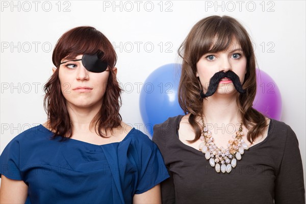 Studio Shot of dressed up young women . Photo : Jessica Peterson