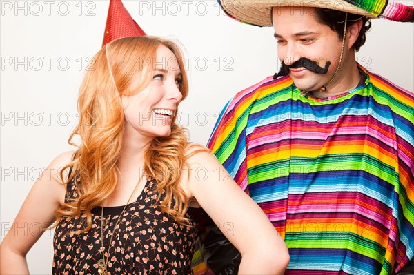 Studio Shot of two people dressed up. Photo : Jessica Peterson