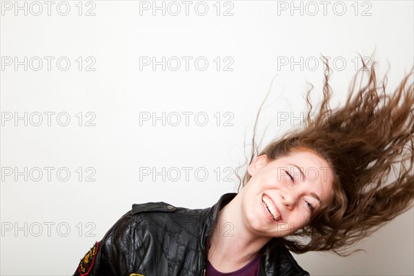 Studio Shot of young woman shaking head. Photo : Jessica Peterson