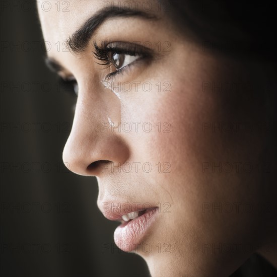 Close-up of young woman crying.