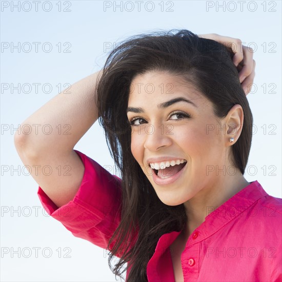 Portrait of young woman laughing.