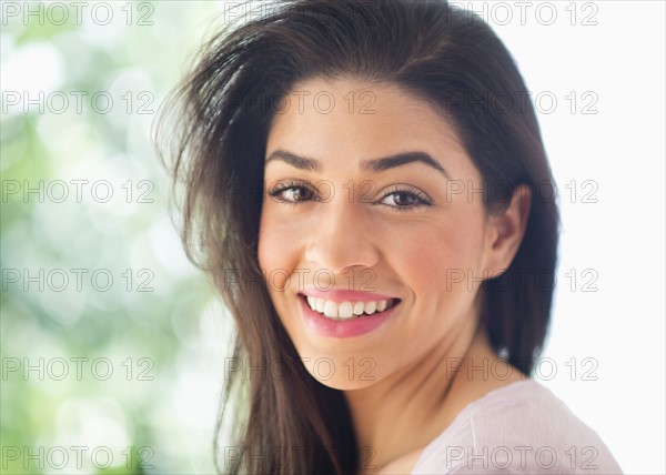 Portrait of young woman smiling.