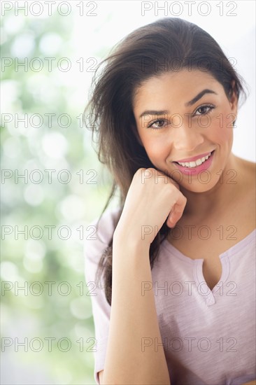 Portrait of young woman smiling.