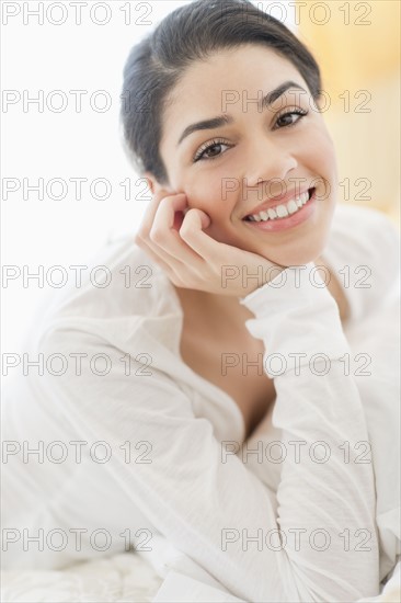 Portrait of young woman smiling.