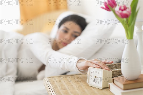 Young woman waking up.