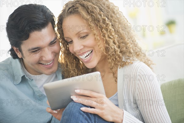 Couple looking at tablet pc.