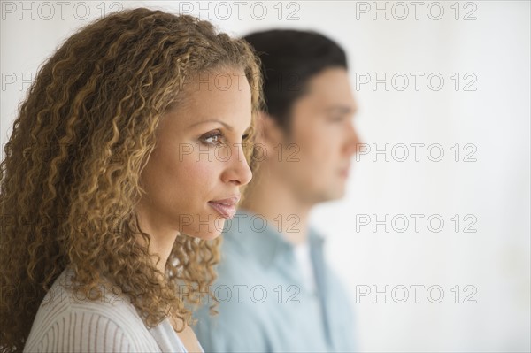 Profile of couple with focus on woman in foreground.