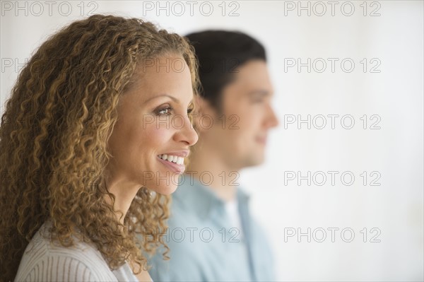 Profile of couple with focus on woman in foreground.