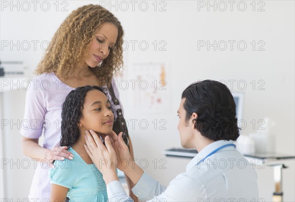 Mother with daughter (12-13) visiting pediatrician.