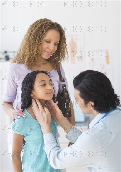 Mother with daughter (12-13) visiting pediatrician.