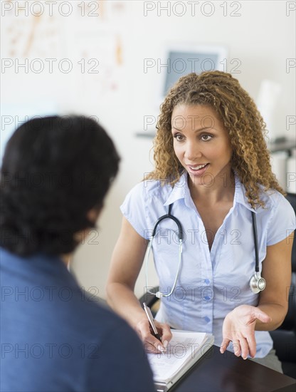 Doctor and patient talking in clinic.