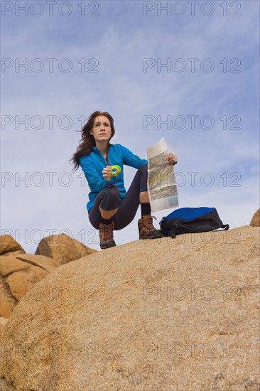 USA, California, Joshua Tree National Park, Female hiker on rocks.