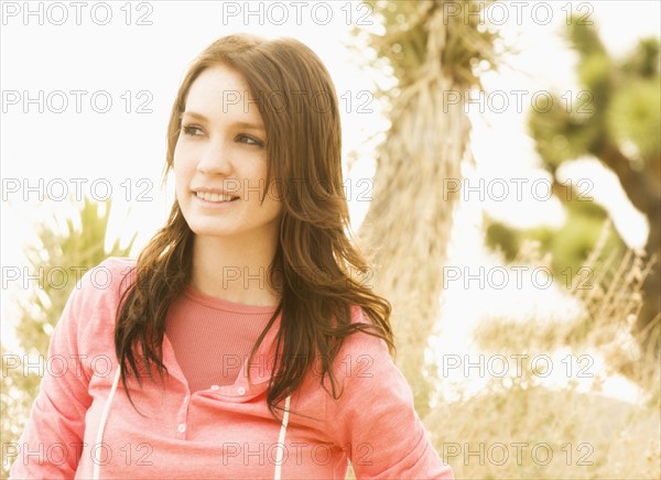 USA, California, Joshua Tree National Park, Portrait of young woman in desert.