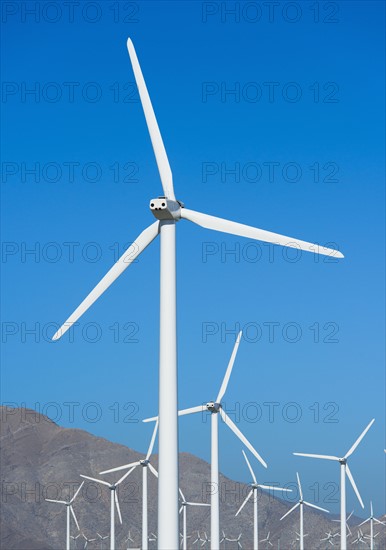 USA, California, Palm Springs, Wind turbines against blue sky.