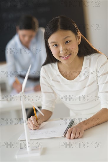 Portrait of female student (14-15) at school.