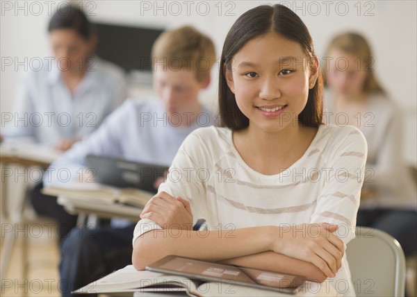 Students (14-19) using digital tablets at school.