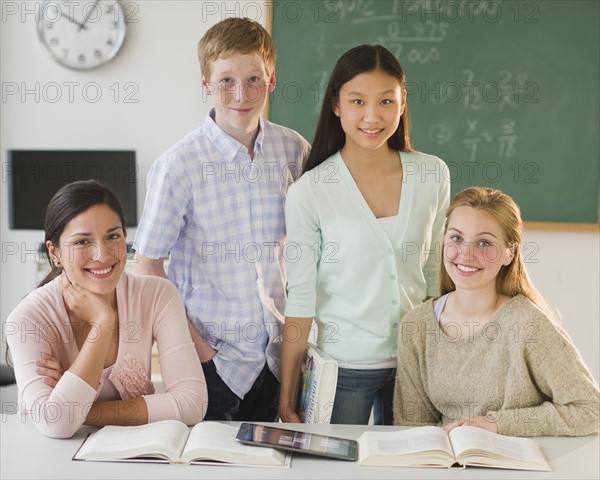 Portrait of students (14-19) in classroom.