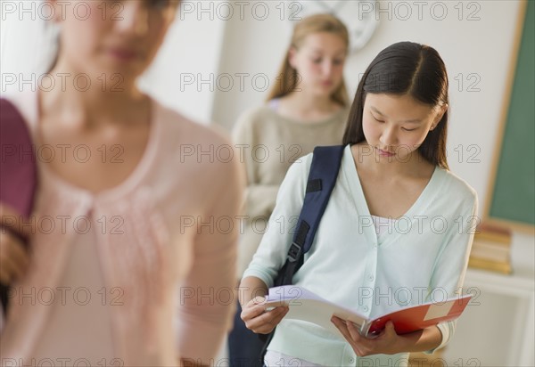 Students (14-19) in classroom.