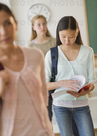 Students (14-19) in classroom.