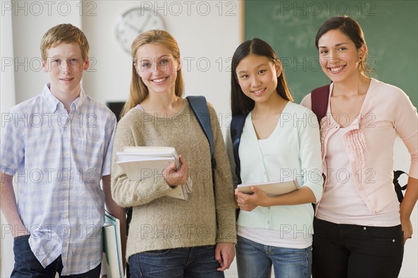 Portrait of students (14-19) in classroom.