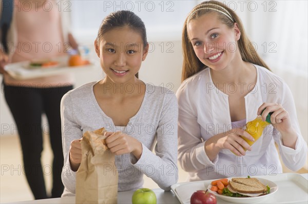 Female students (14-19) having lunch.