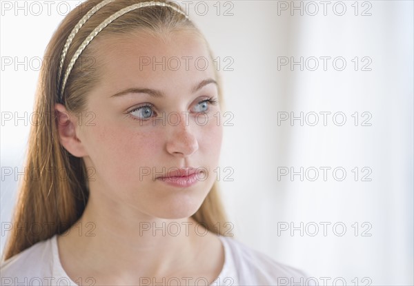 Portrait of girl (16-17) thinking.