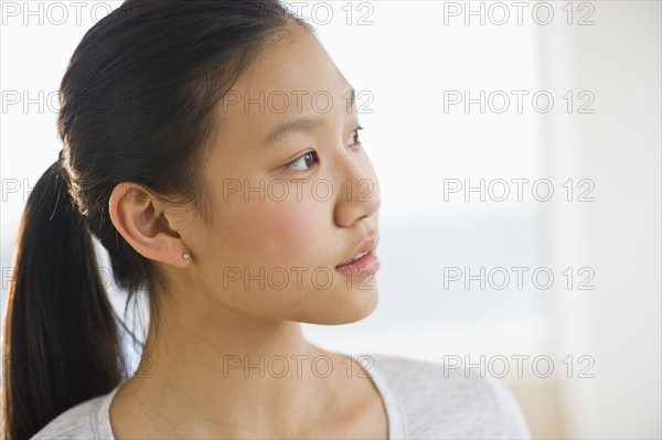 Portrait of girl (14-15) thinking.