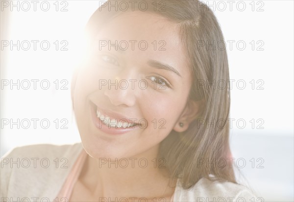 Portrait of young woman smiling.