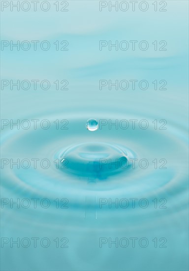 Drop falling into water.