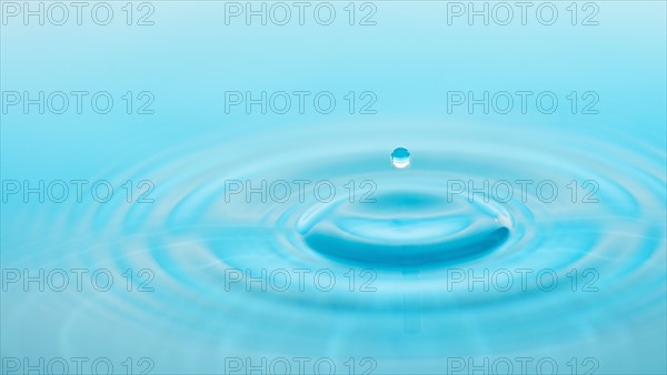 Drop falling into water.