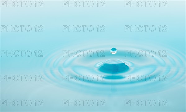 Drop falling into water.