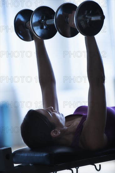 Woman weight lifting.