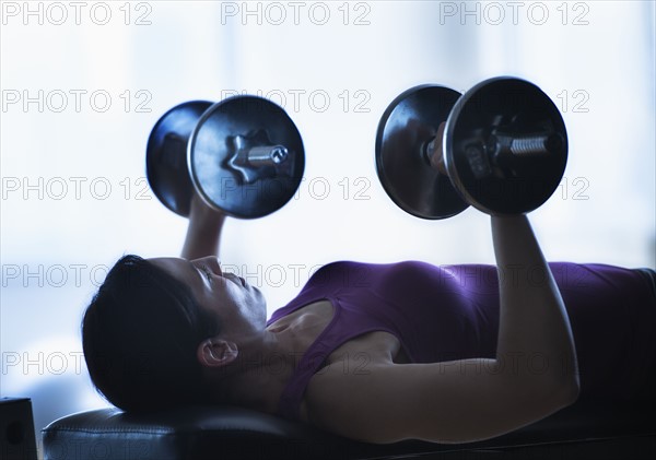 Woman weight lifting.