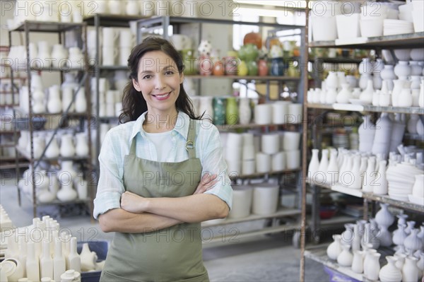 Woman in pottery warehouse.