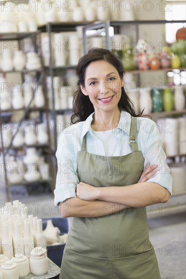 Woman in pottery warehouse.