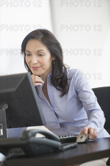 Business woman working on computer.