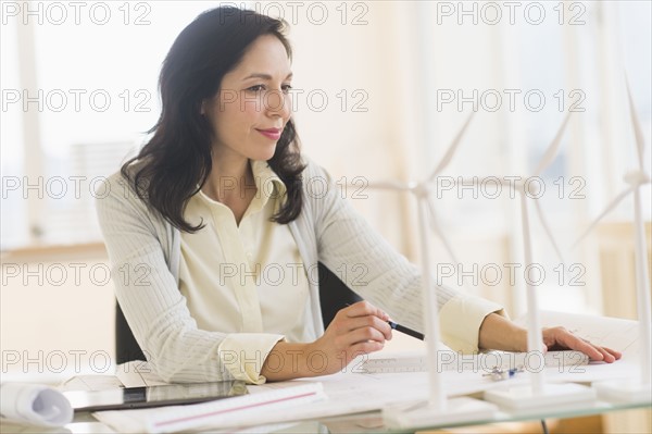 Architect working in office.