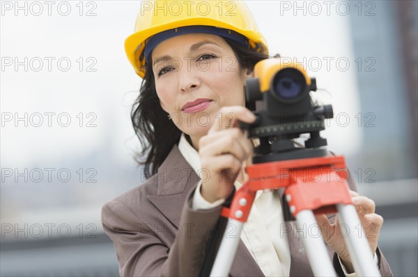 Architect using theodolite.