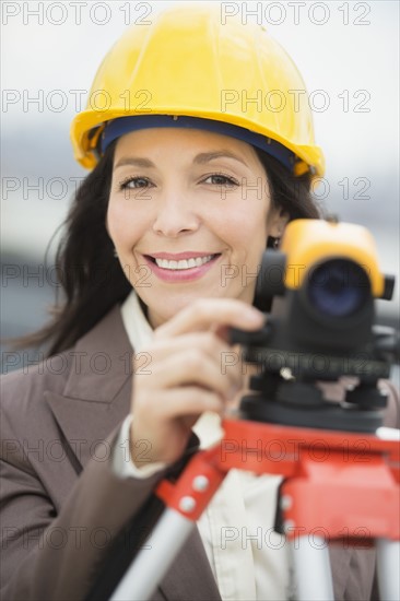 Architect using theodolite.