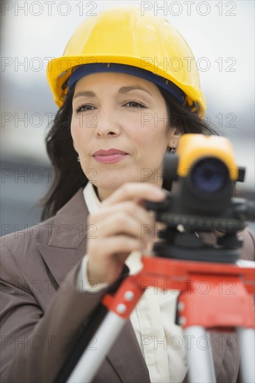 Architect using theodolite.